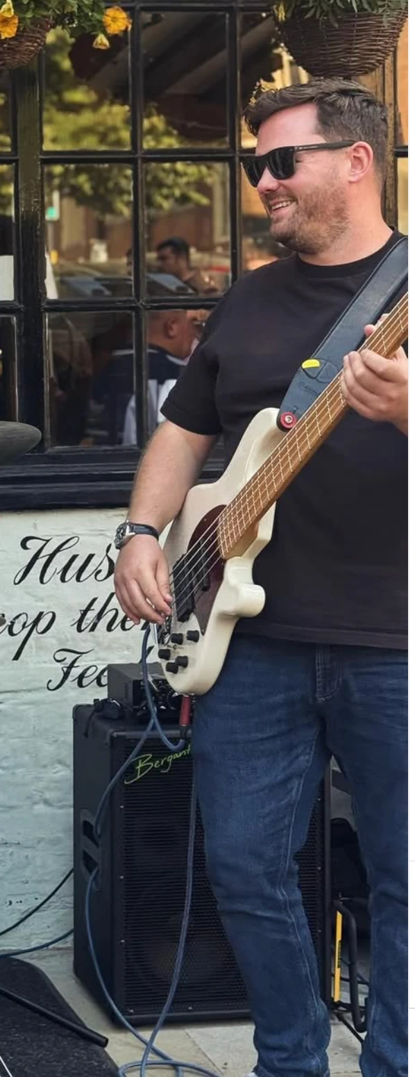 Jack Collier performing live on his bass guitar
